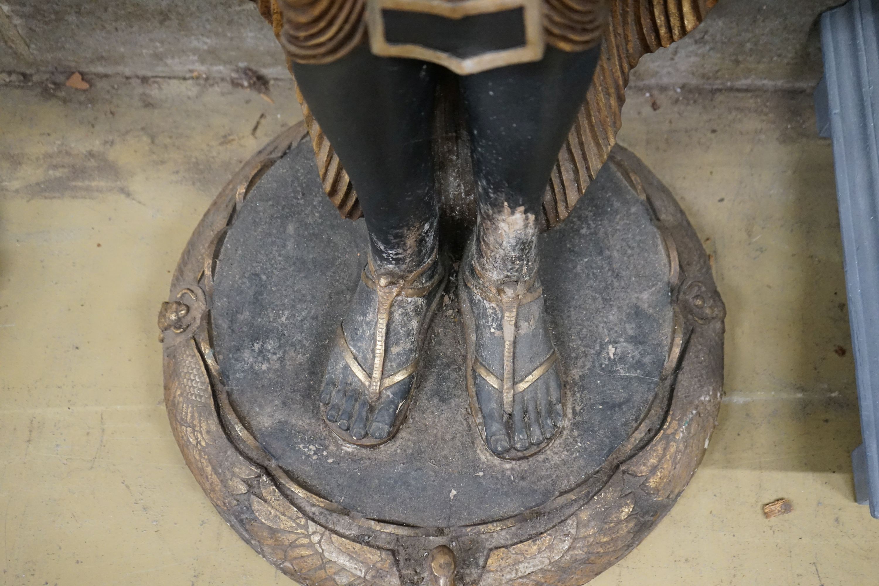 A pair of composition Egyptian style figural planters, height 185cm